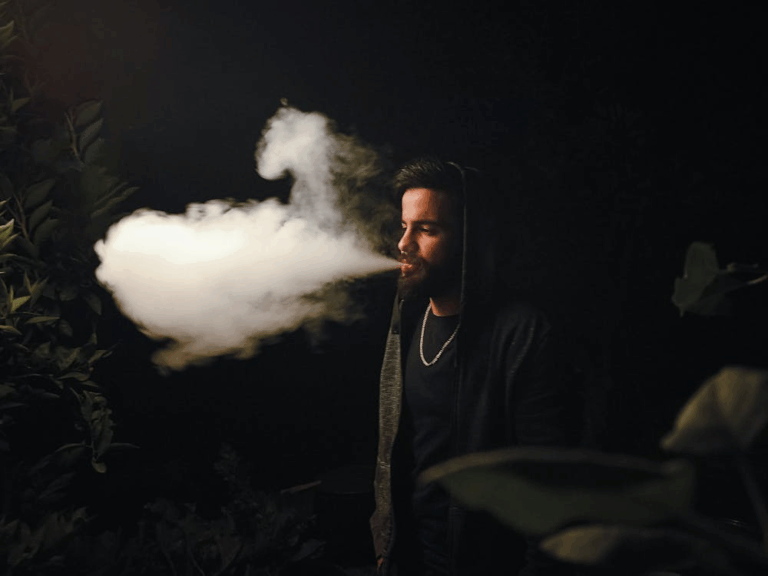 man taking a vape